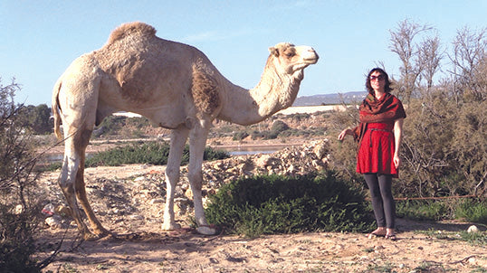 Badger Rebecca and camel in Morocco, where Badger's argan oil comes from