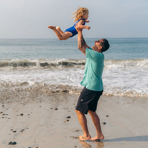 baby mineral sunscreen cream dad and baby on beach