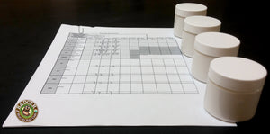 Badger's sunscreen in lab batch jars on top of a quality control spreadsheet