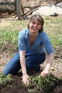 Badger Emily helping plant the garden.